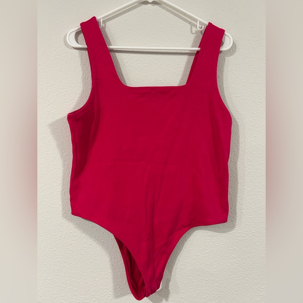 A new day hot pink body suit